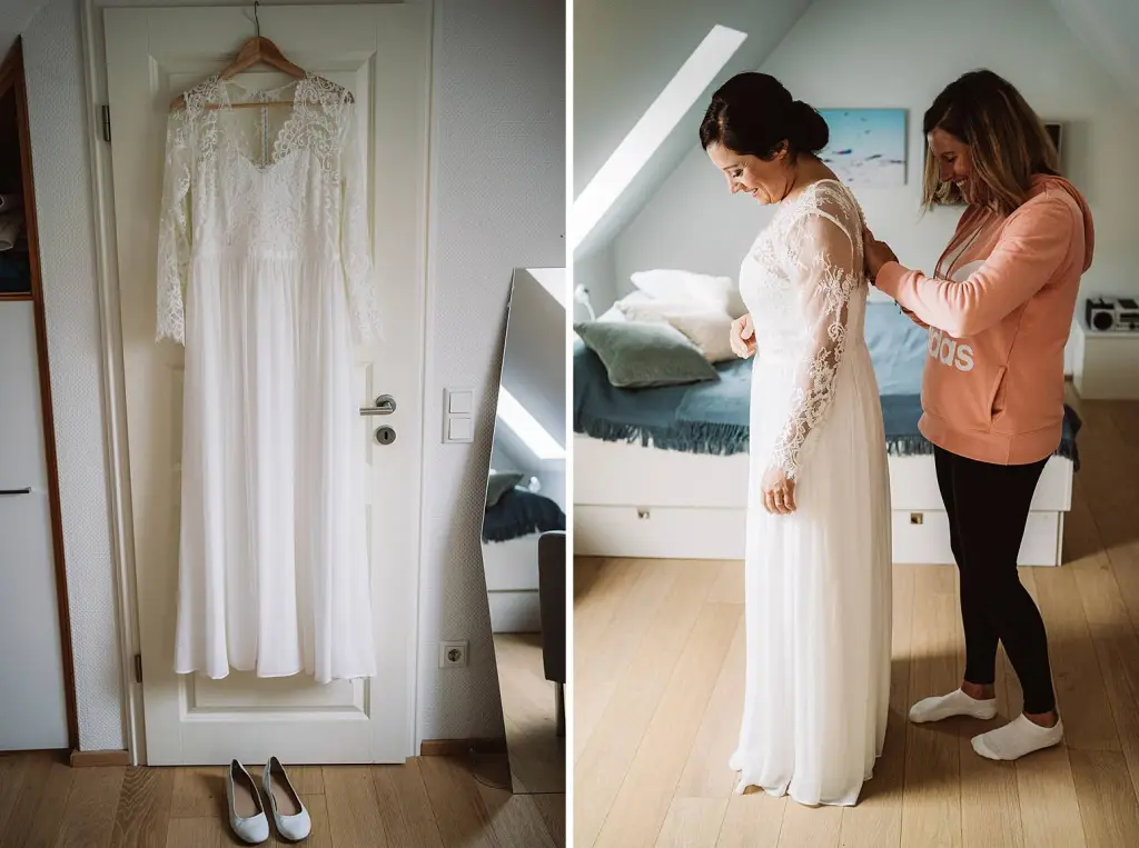 Hochzeitsfotograf Norderney – Braut beim Anziehen ihres Kleides